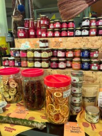 Various jams, jellies, and dried fruit at a market stall