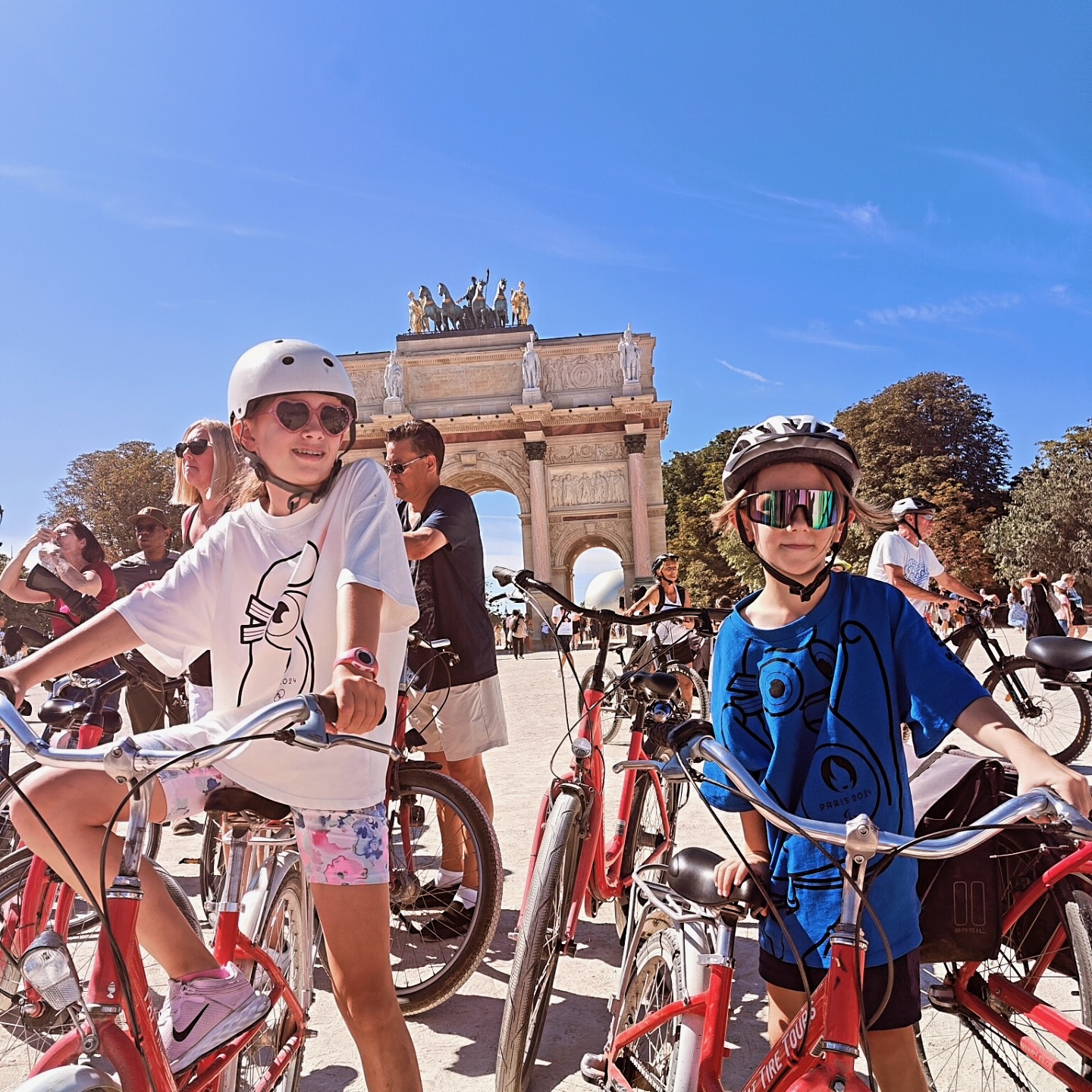 Two kids enjoy a day bike tour in Paris, France